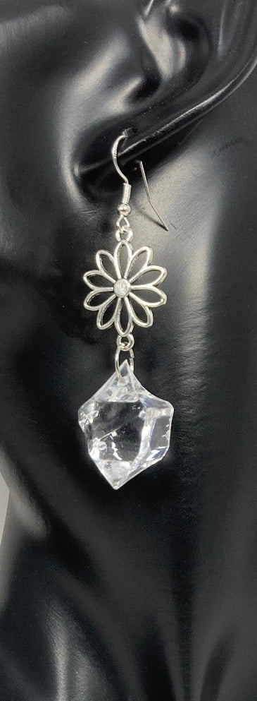The Acrylic Diamond Earrings are 3/4" silver alloy floral charm with a Diamond-looking acrylic stone. The acrylic "stone" is crystal clear and has a diamond shape - which makes them look fabulously authentic! They are finished with a Sterling silver ear wire.