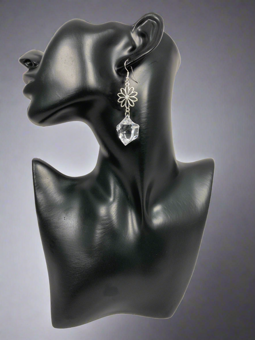 The imperfect clear acrylic shape gives it an authentic (Diamond) look, while the 3/4" flower charm checks the feminine box. This earring is approx. 2 1/2" long. Finished with a sterling silver ear wire, at a price to be happy about. A classy look for a holiday or any occasion. At an awesome value!