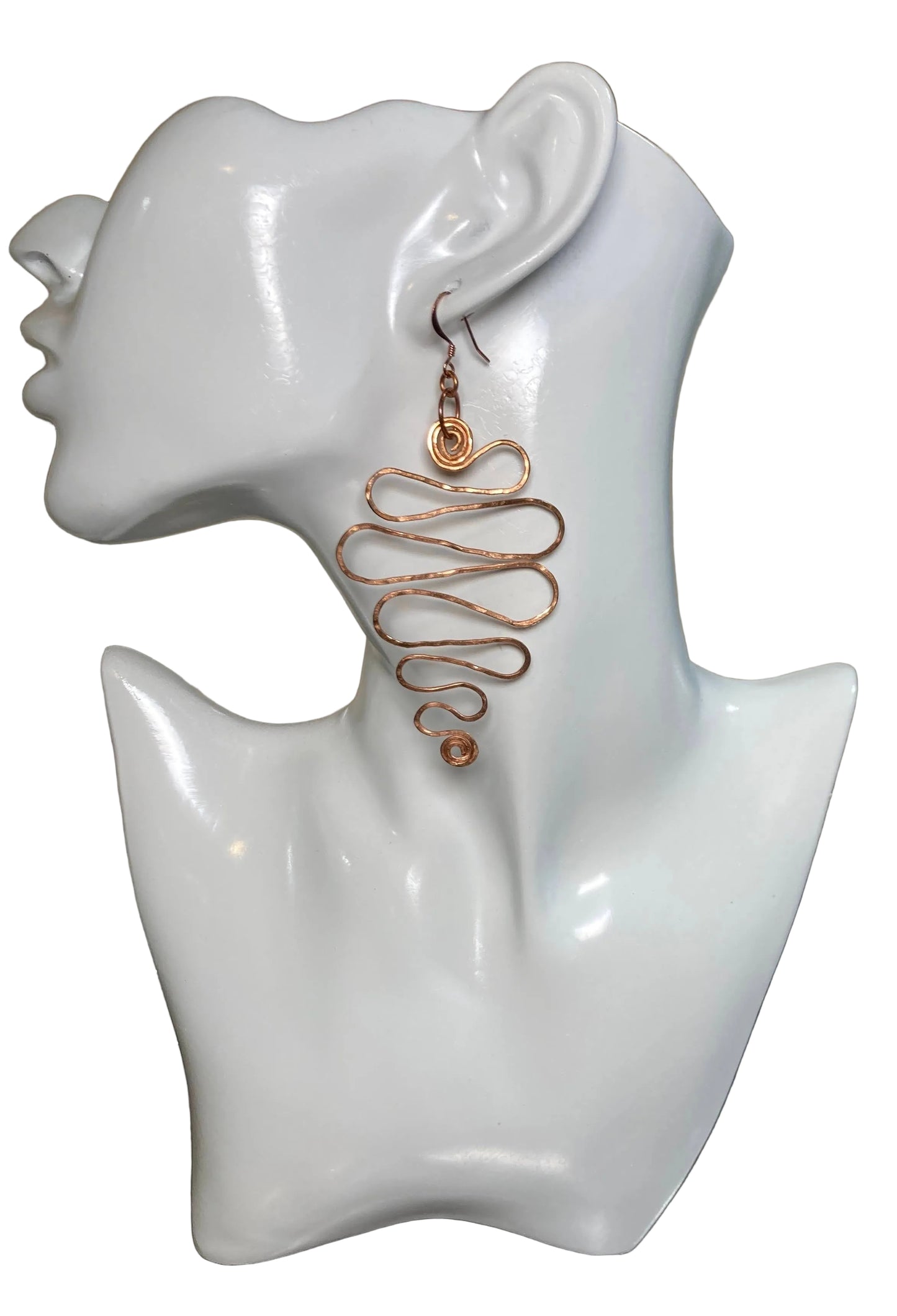 Copper Grad Swirl - Earrings (Wide) Lightweight 100% copper earrings that gradually grow from a small S shape at bottom then wider and ends with a larger (approx.) 1" swirl at top. The copper ear wire finishes the look