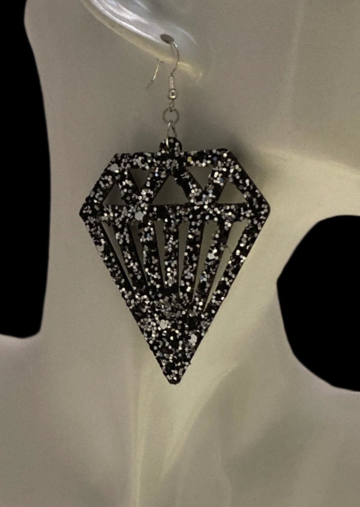 Large Diamond Sparkling Earrings, featuring a Black and Silver diamond cut-out and an unmistakable statement design from CBU. Flaunt your daring style and daring spirit! Measurements: 2 x 2 1/4", not including the Sterling silver ear wire. A fab find at $26.00 Diamonds on Diamonds, that really sparkle!