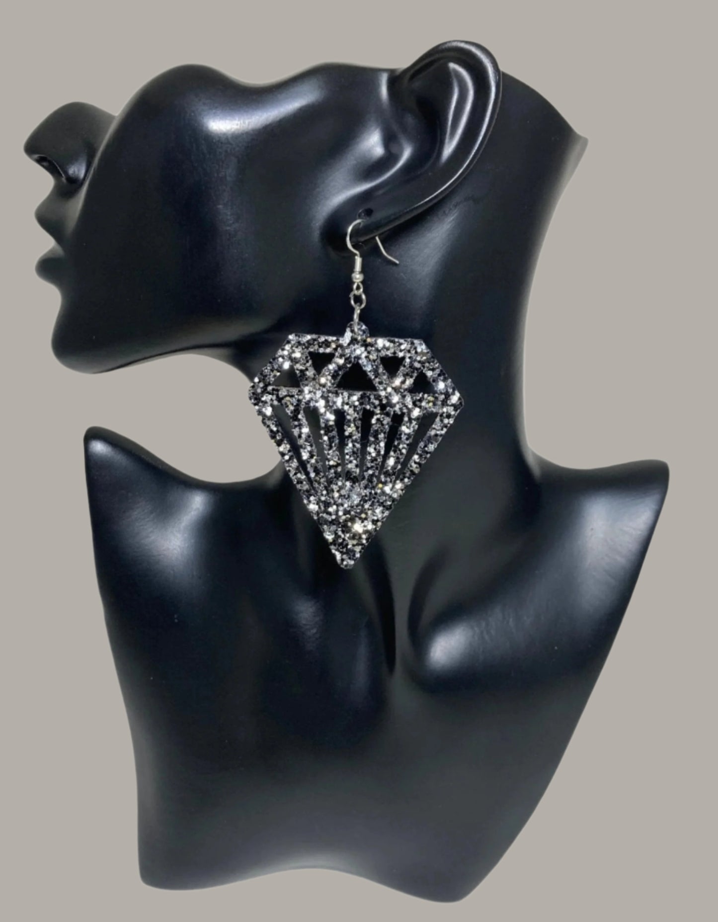 Large Diamond Sparkling Earrings, featuring a Black and Silver diamond cut-out and an unmistakable statement design from CBU. Flaunt your daring style and daring spirit! Measurements: 2 x 2 1/4", not including the Sterling silver ear wire. A fab find at $26.00 Diamonds on Diamonds, that really sparkle!