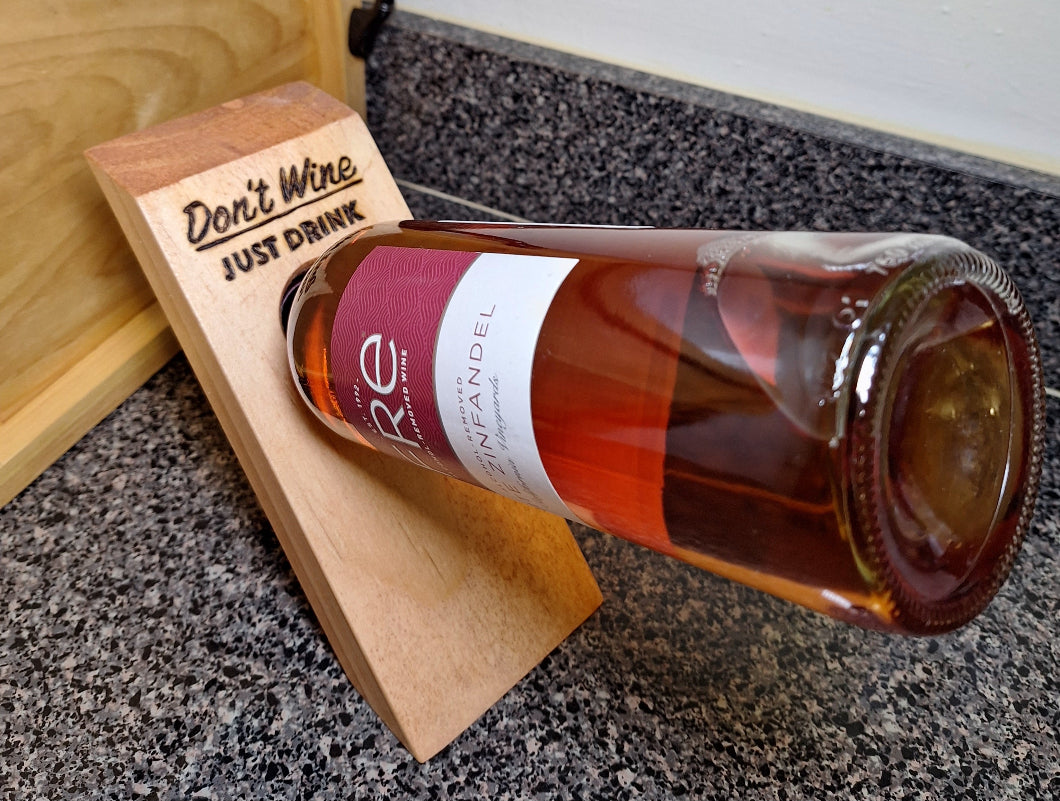 This compact wooden board (9x5") seems to defy gravity.
Available in Golden Pecan (GP) stain finish.
Currently avail. with 3 quirky phrases burned into each board: This board reads, 3 - Don't Wine - Just Drink and burned into the top half of the board.