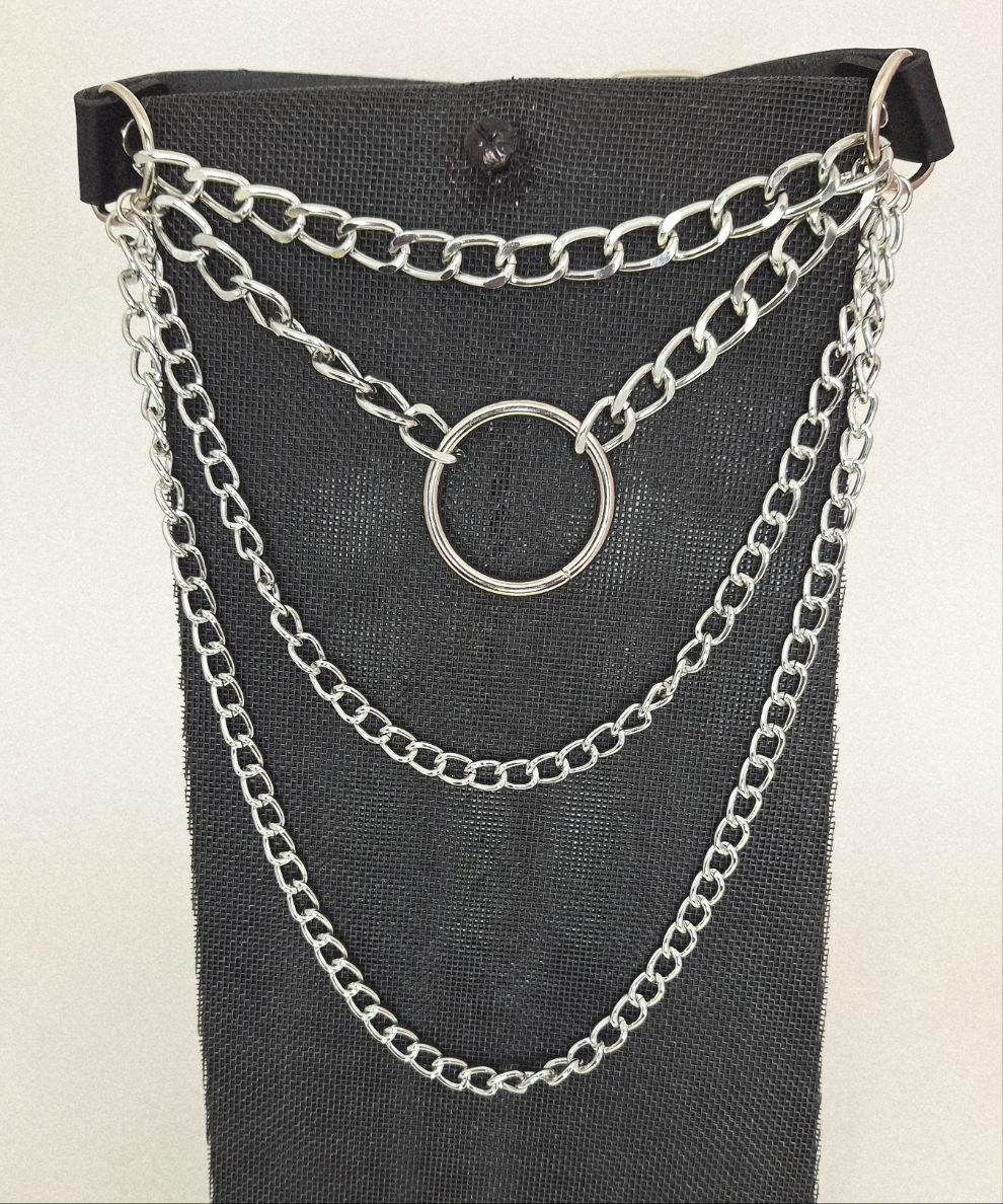 Shown in Black faux leather with 3 levels of chains and a 1 1/4" centered sphere. It hangs at a comfortable length of 6 1/2" from its lowest point. It includes 3 strategically placed rivets (2 and1) on either side with a 1" wide buckle to make it easier to fasten. 5 notches completes the Choker so you can choose the best length for your outfit.