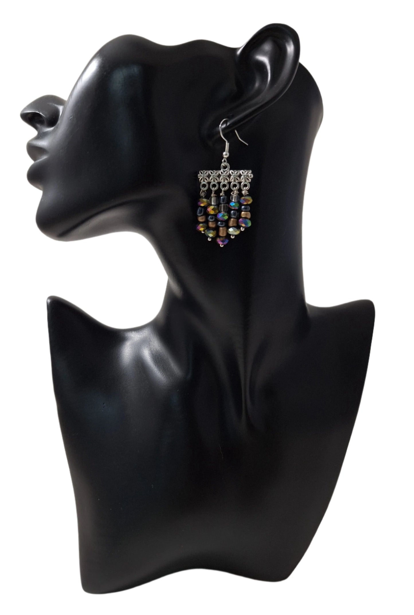 Make a statement with this playful and stylish Festive pair. You'll be the life of the party and well accessorized for any occasion.
Measurements: 1 1/4" (not including the Sterling silver ear wire).
Six colorful beads in graduating sizes - including iridescent Rondelle beads, gold, black Hermatite, and clear beads. 