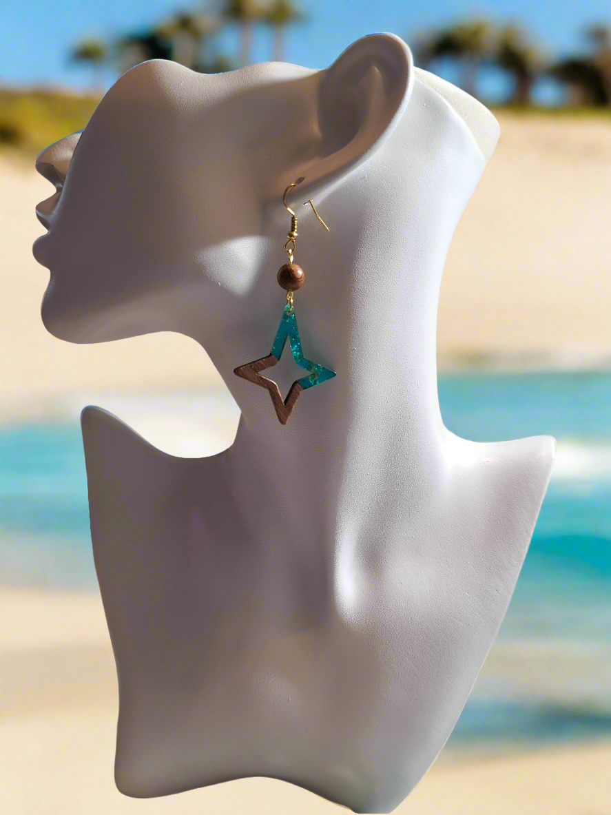 These earrings are made of turquoise colored resin acrylic with gold flakes inserted, with a 1/4" driftwood-look bead for a perfect complement. Finished with durable gold plated ear wires.
Measurements: 1 1/2" (approx.)