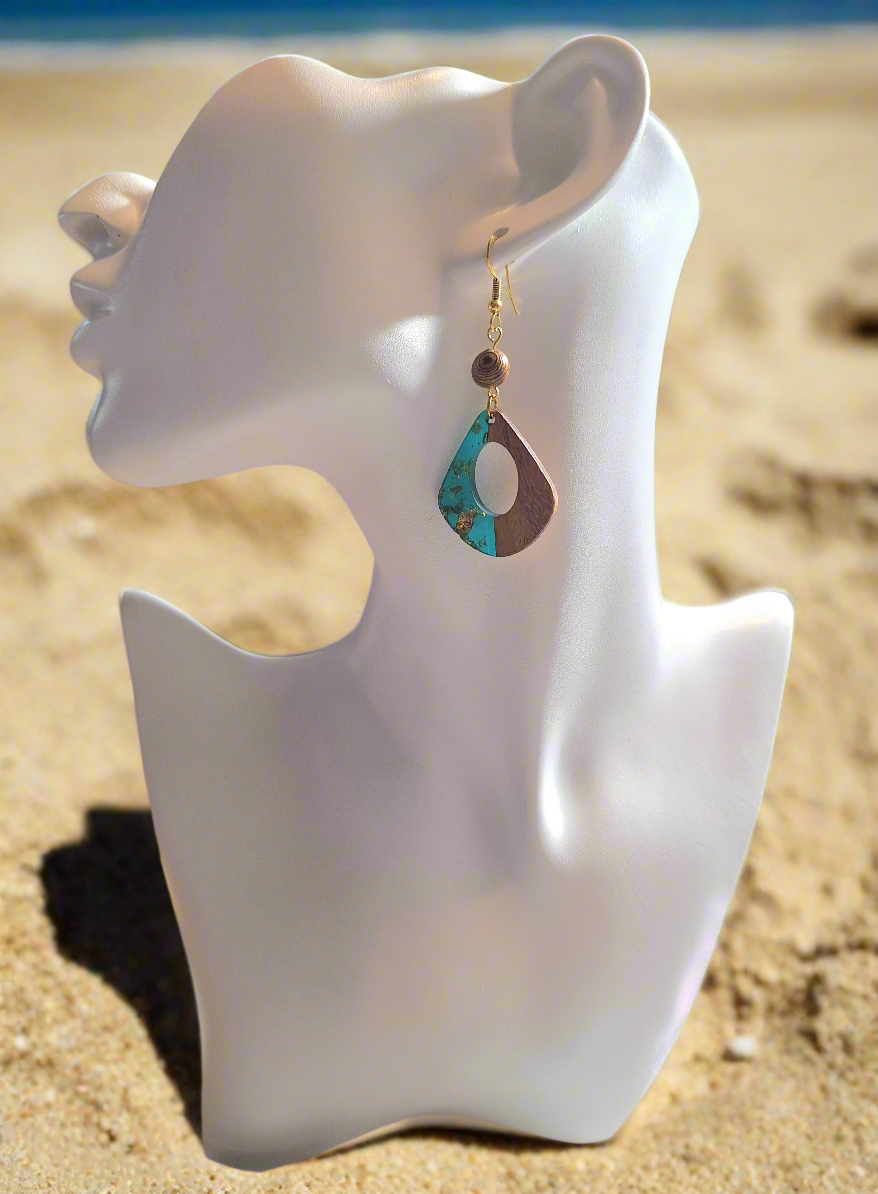 These earrings are made of turquoise colored resin acrylic with gold flakes inserted, with a 1/4" driftwood-look bead for a perfect complement. Finished with durable gold plated ear wires.
Measurements: 1 1//2" (approx.)