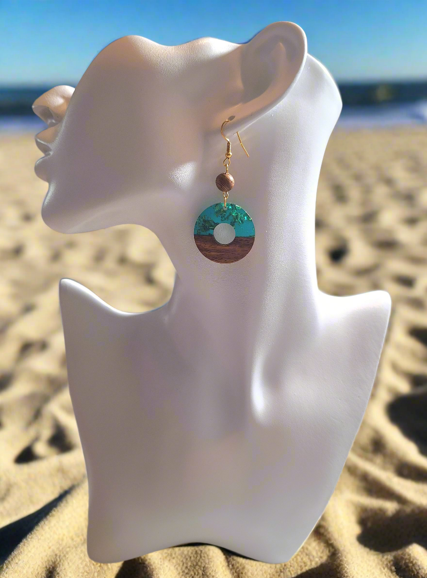 These earrings are turquoise colored resin acrylic with a 1/4" driftwood-look bead for a perfect complement. Finished with durable gold plated ear wires.
Measurements: 3/4" in length (approx.)
Head's Up: This is a can't miss, Buy 1 get 1 item. Buy your first pair for $8.00 and get the 2nd for $7.00. A really good buy at (two for $15.00.)