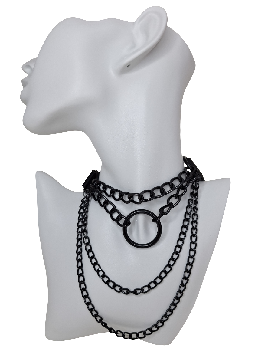 Black chain necklace on a white mannequin bust with a white background