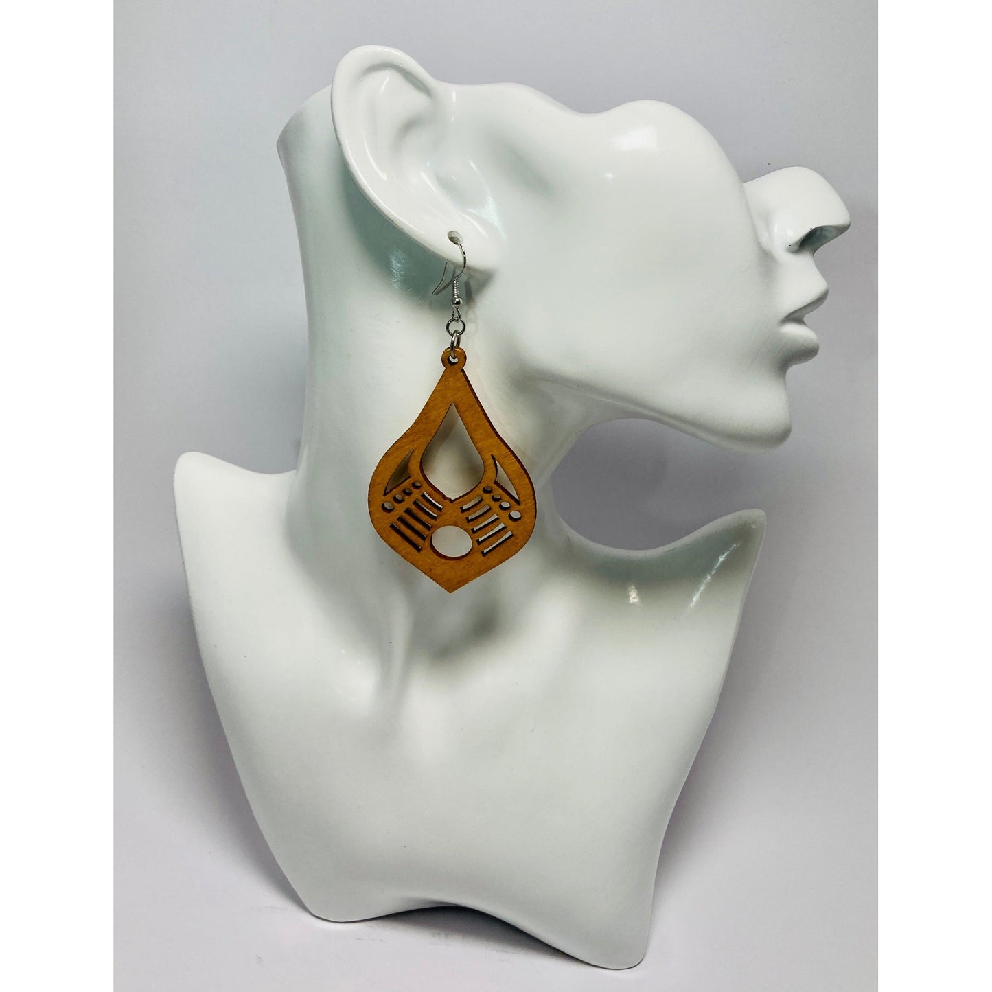 Style #2 brings to mind music. (To my eyes) A Banjo-type design. Slightly smaller than the other's in this collection (Approx. 2.1/4" wide and 2.5" long). Finished with a Sterling silver ear wire.