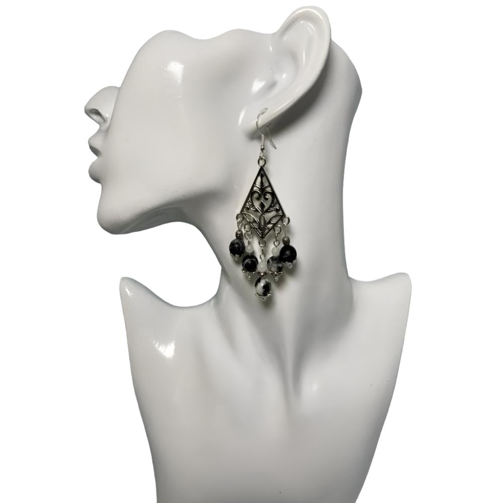 Chandelier Silver Earrings: Antique Tibetan Silver with 5 rows of marbled black/white beads hanging from three levels. Authentic and Beautiful! Approximately 3.5" and finished with a Sterling silver ear wire.