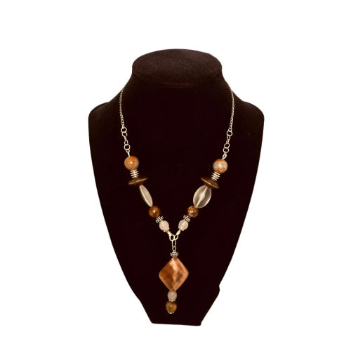 Copper Divine Necklace - (Copper Devine Earrings sold separately) Made using semi precious stones and a copper distressed main bead that is hollow and approx. 1 1/4". A flying saucer shaped bead takes this design up a notch. Finally, the marbleized semi-precious 10mm bead "rounds" out the look.