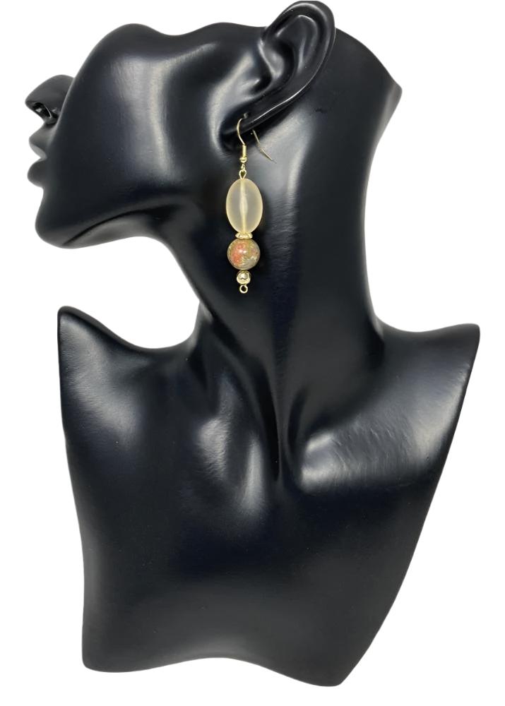 O'Natural Mist Earrings - A light gold colored & frosted glass oval shaped stone. Paired with a marble stone and finished with a bronze bead at the bottom. Medium length at approx. 1 3/4" and finished with a gold plated stainless steel hypoallergenic bronze ear wire.