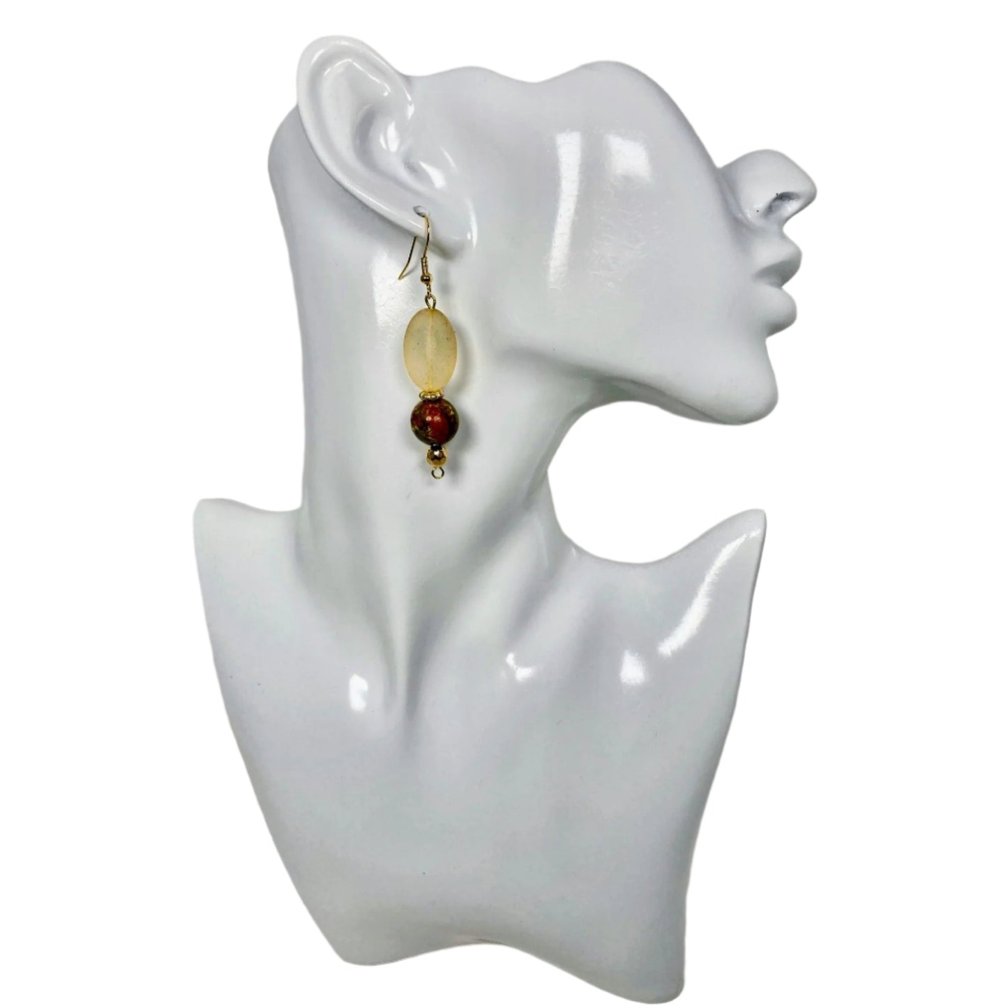 Second view of O'Natural Mist Earring:This is a light gold colored & frosted glass oval shaped stone; followed by a marble stone and finished with a bronze bead at the bottom. Medium length at approx. 1 3/4" and finished with a gold plated hypoallergenic ear wire.