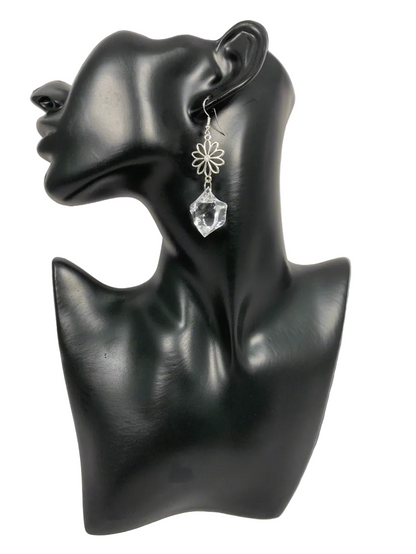 The imperfect clear acrylic shape gives it an authentic (Diamond) look, while the 3/4" flower charm checks the&nbsp;feminine box. This earring is approx. 2 1/2" long. Finished with a sterling silver ear wire, at a price to be happy about.  A&nbsp;classy look for a holiday or any occasion. At an awesome value!
