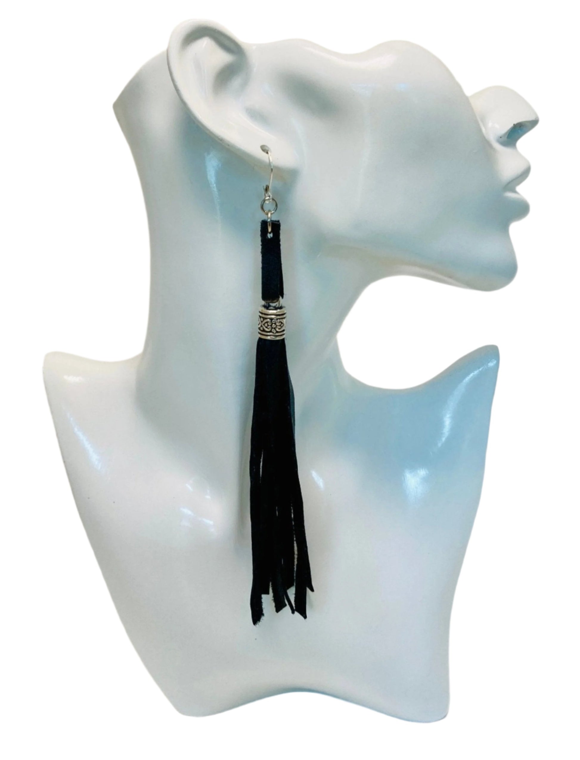 Black Leather Tassel earrings. These fashionable accessories exude elegance and sophistication, allowing you to make a lasting impression.

Complete your ensemble with the exclusive matching choker chain (sold separately) for the ultimate touch of style.
Measuring at 5 3/4" in length (excluding the hypoallergenic Stainless Steel lobster ear wire), these earrings are the perfect addition to your wardrobe.