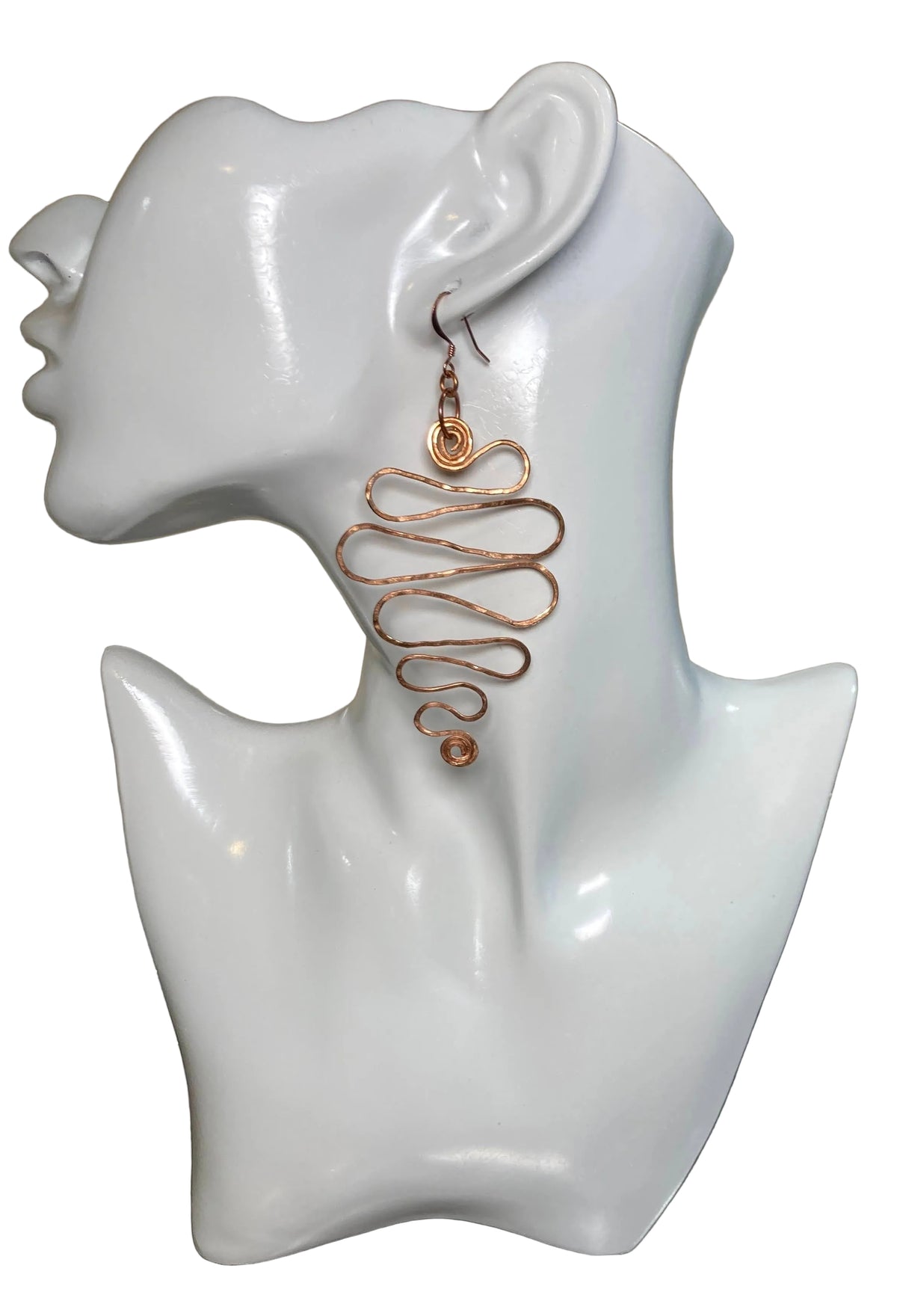 Copper Grad Swirl - Earrings (Wide) Lightweight 100% copper earrings that gradually grow from a small S shape at bottom then wider and ends with a larger (approx.) 1" swirl at top. The copper ear wire finishes the look 