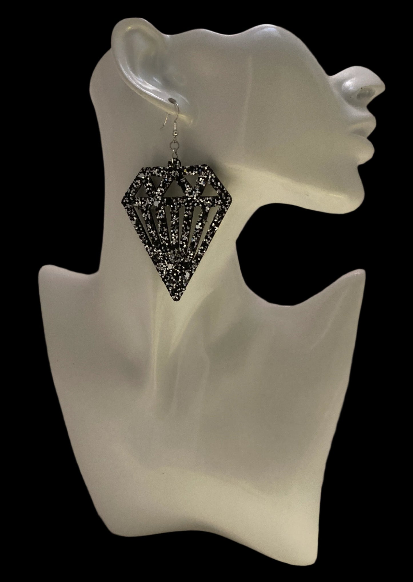 Large Diamond Sparkling Earrings, featuring a Black and Silver diamond cut-out and an unmistakable statement design from CBU. Flaunt your daring style and daring spirit!&nbsp;  Measurements: 2 x 2 1/4", not including the Sterling silver ear wire. A fab find at $26.00 Diamonds on Diamonds, that really sparkle!