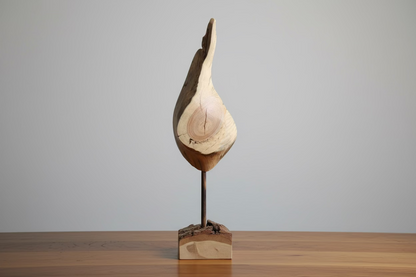 A rustic live-edge wood sculpture on a dark wooden stand with a square wooden base, displayed honey stained table against a gray wall backdrop. Measurements: 12" tall x 5" at it's widest point. 

The note is a non-specific wood origin found in Northeastern Massachusetts while it’s base is beautifully weathered oak wood block.
(Not including the base) which is; 4" x 3" x 2".