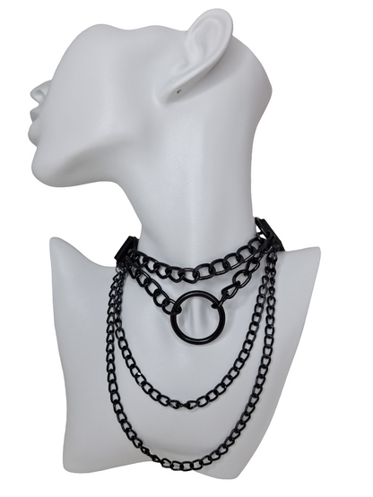 Black chain necklace on a white mannequin bust with a white background