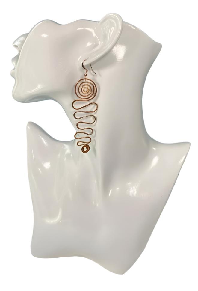 Copper Grad Swirl - Earrings (Narrow) Lightweight 100% copper earrings that gradually grow from a small S shape at bottom then wider and ends with a larger (approx.) 1" swirl at top. The copper ear wire finishes the look nicely.