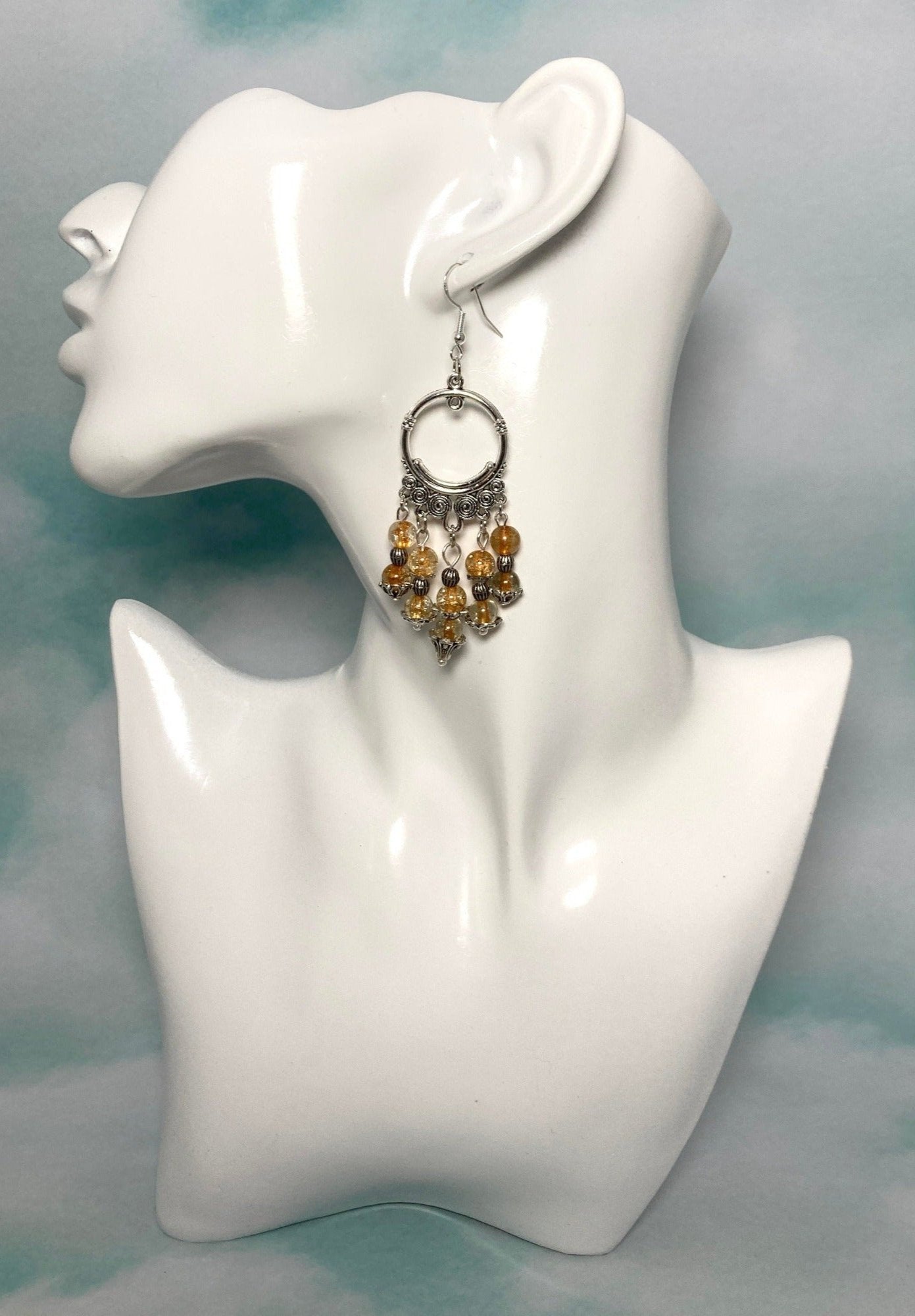 Chandelier Sphere shaped Silver colored Earrings. Amber colored cracked glass beads, Bohemian & Classic look. Approximately 3" long, including the hypoallergenic hooks. 