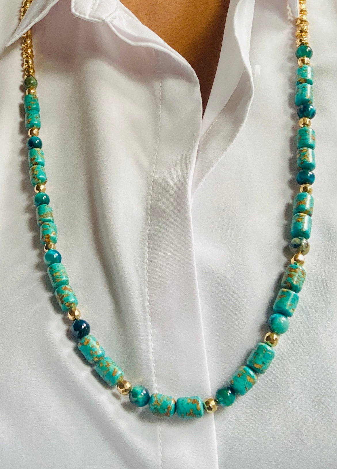 This beautiful necklace combines the look of genuine turquoise stones with hypoallergenic gold-painted alloy and gold-plated beads & chains. At 36" long, it can be doubled to create a more luxurious and unique look.